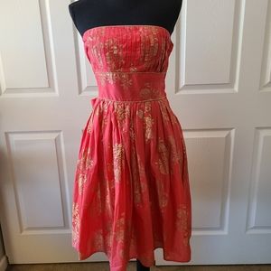 Coral and gold strapless dress